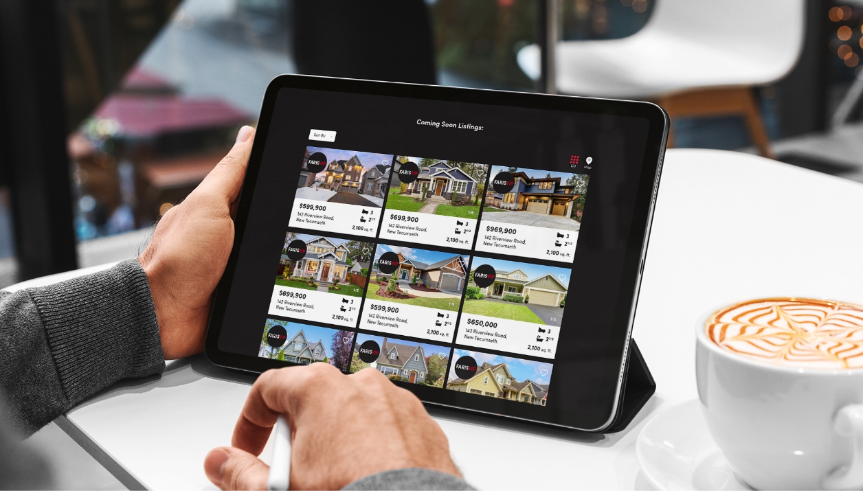 A man viewing FarisVIP listings on a tablet device.